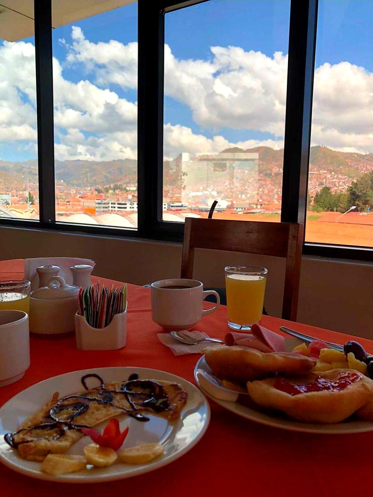 Breakfast by the window with city views