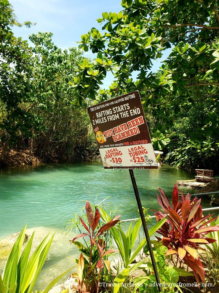 River with sign in foreground